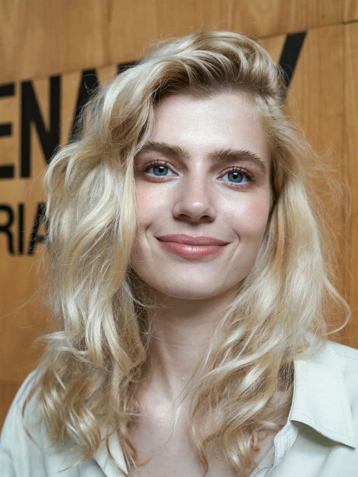 Voluminous Sandy Blonde Long Layers with Side Bangs